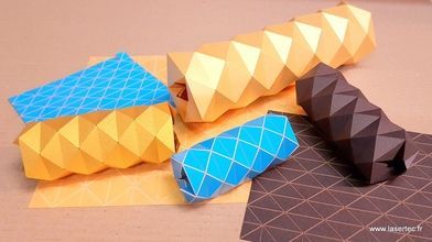 Papier découpé et rainé au laser jaune, bleu et marron